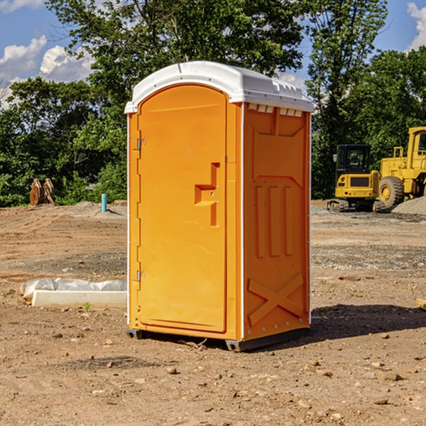 what is the cost difference between standard and deluxe portable toilet rentals in Adams County Iowa